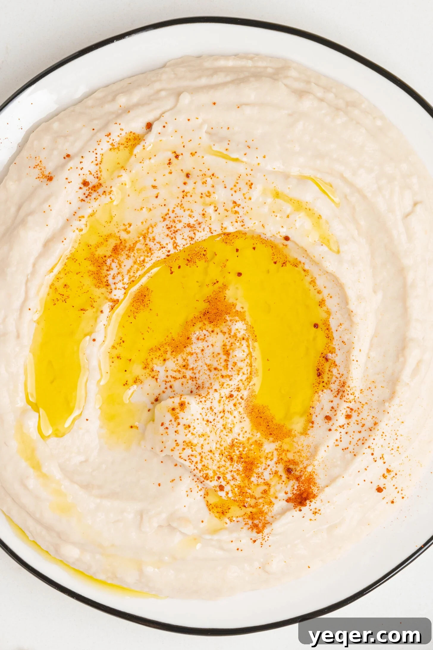 A vibrant plate of white bean hummus, ready to be enjoyed.