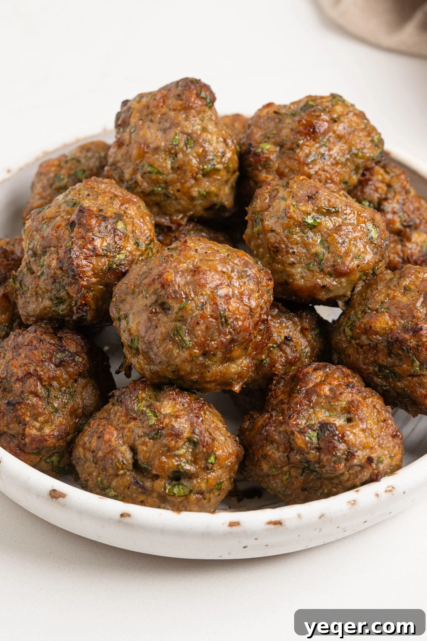 Moroccan Spiced Baked Lamb Meatballs 10 A bowl of baked lamb meatballs.