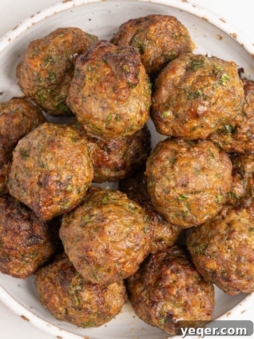 A bowl of baked lamb meatballs.