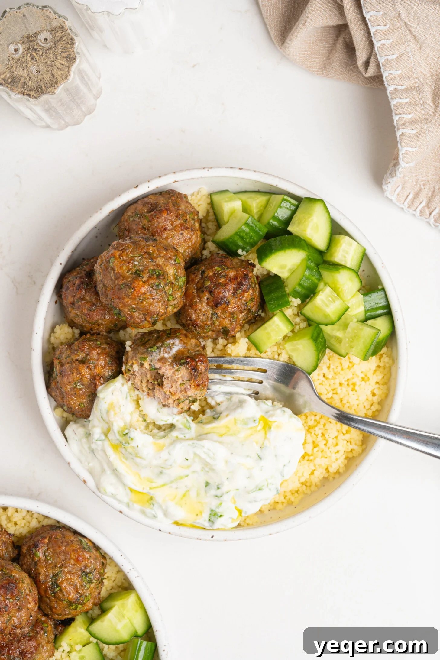 Moroccan Spiced Baked Lamb Meatballs 9 A bowl of couscous, lamb meatballs, and more.