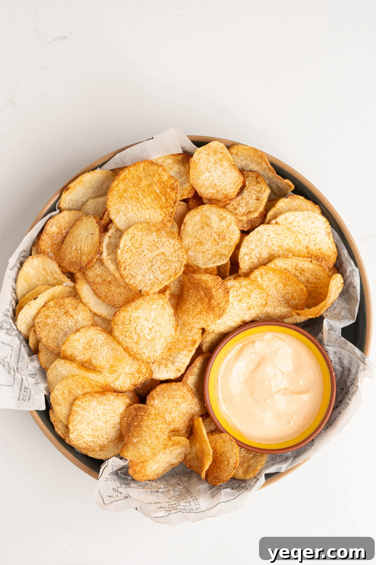 Crispy Taro Chips 30 Minutes Oven and Air Fryer 14 A stunning close-up of a bowl brimming with crispy taro chips, beautifully arranged for a tempting display.