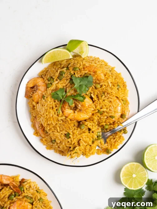 Puerto Rican Arroz con Camarones (Fluffy Rice with Shrimp) on a plate.
