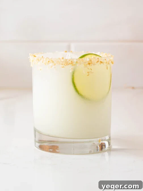 A coconut margarita in a glass.