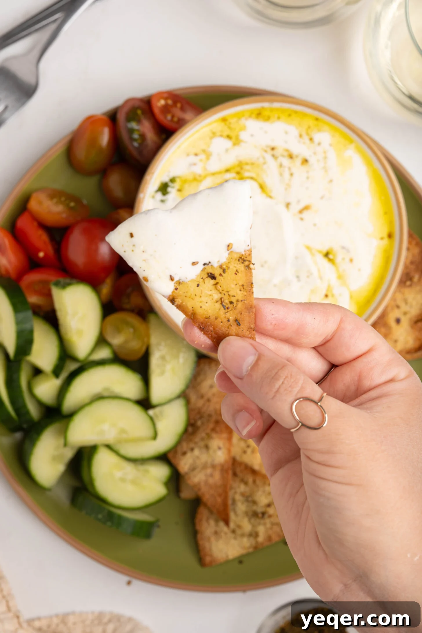 Pillowy 5-Minute Whipped Feta Dip 8 A pita chip dipped in whipped feta.