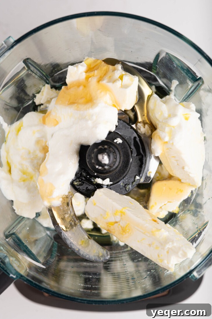 Pillowy 5-Minute Whipped Feta Dip 4 Whipped feta ingredients in a food processor.