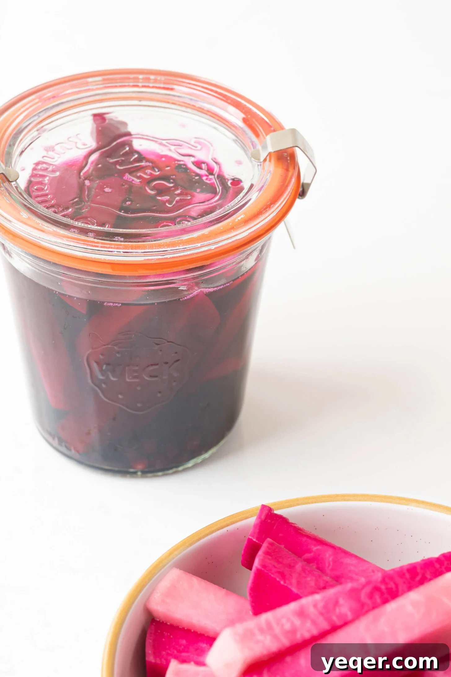 Easy 5-Ingredient Pink Pickled Turnips 11 A single jar of pink pickled turnips, showcasing the finished product and its appealing color.