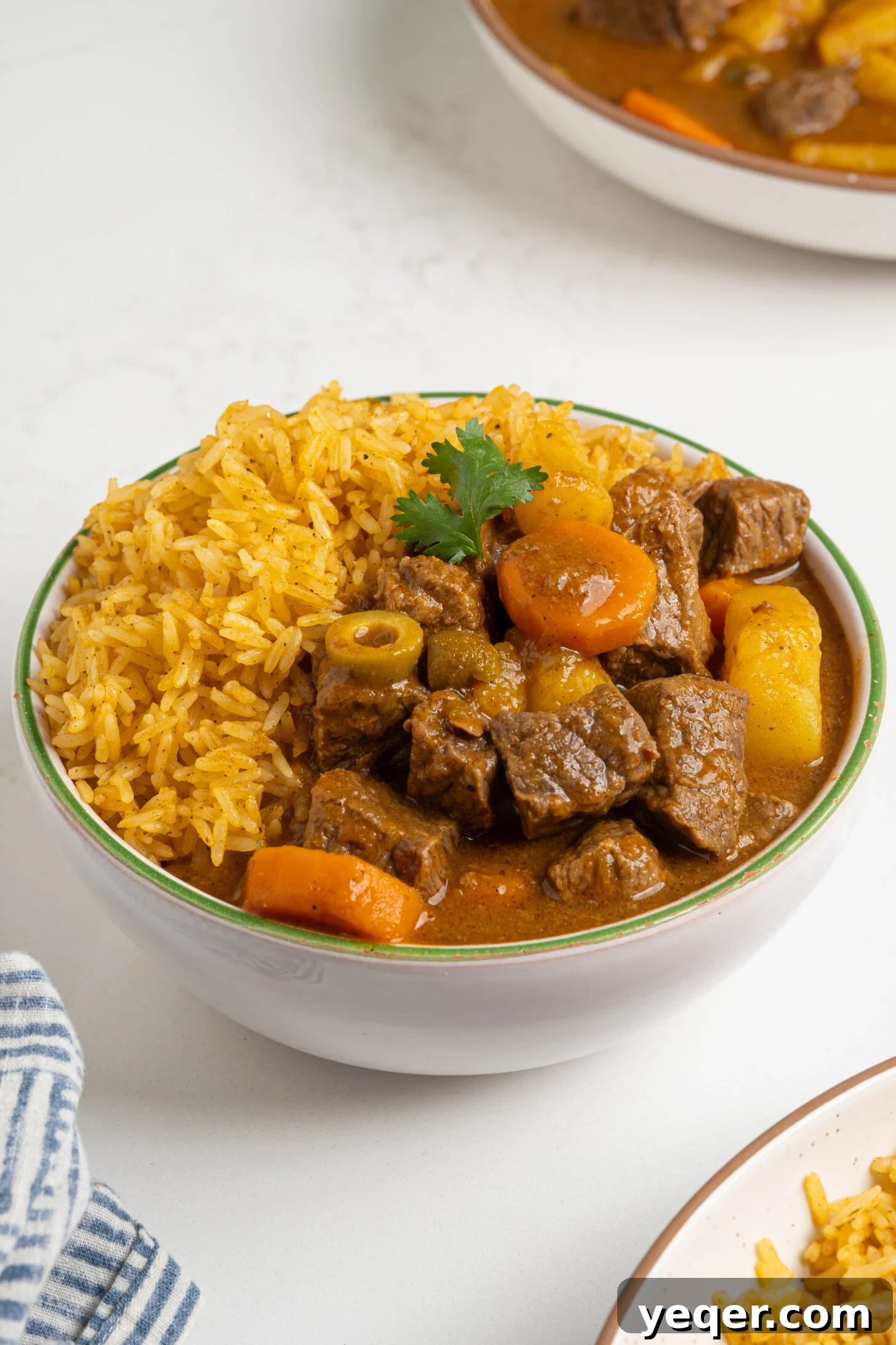 Carne Guisada The Ultimate Beef Stew 11 A bowl of Puerto Rican beef stew with rice.