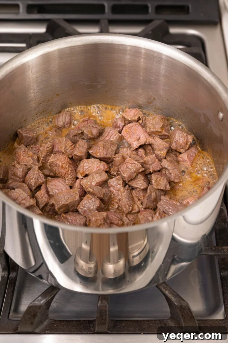 Carne Guisada The Ultimate Beef Stew 5 Beef browning in a pot.
