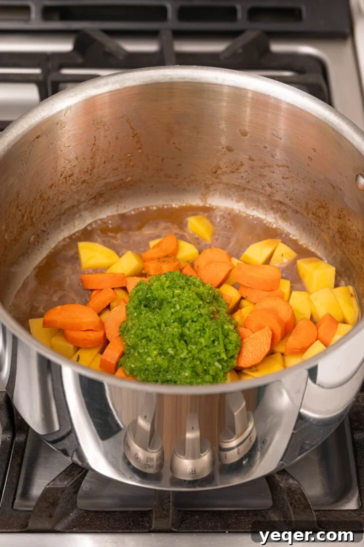 Carne Guisada The Ultimate Beef Stew 6 Sofrito with veggies in a pot.