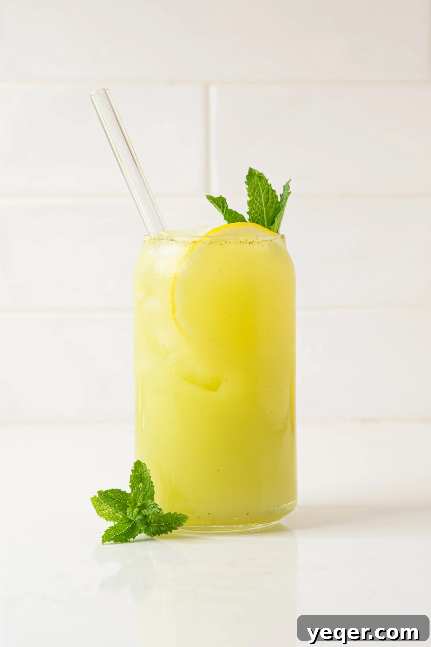 Mediterranean Breeze Mint Lemonade 9 A glass of mint lemonade, with ice and garnishes, ready to drink.