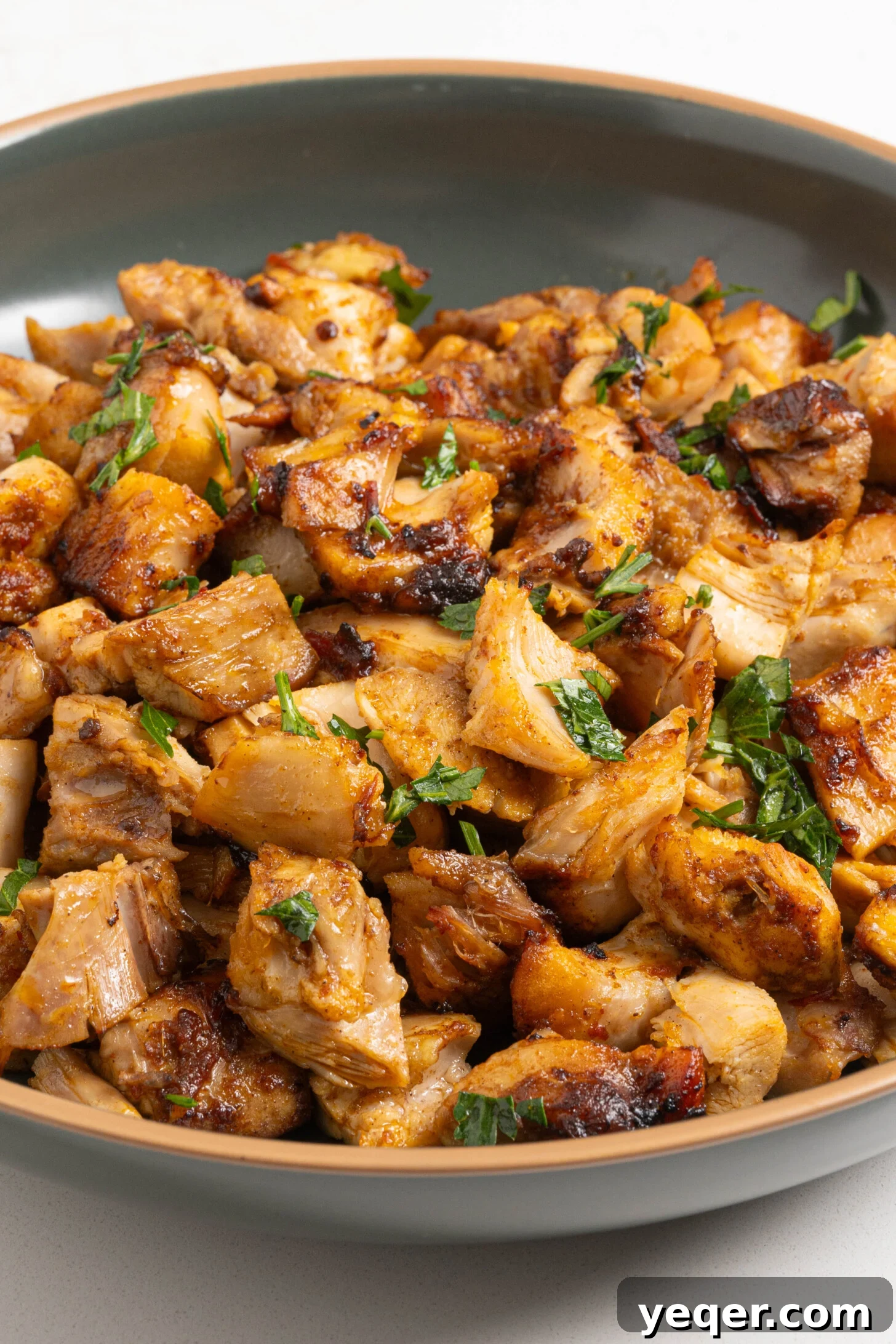 Spicy Sweet Harissa Honey Chicken 10 Diced harissa honey chicken in a bowl.