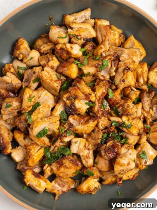 Diced harissa honey chicken in a bowl.