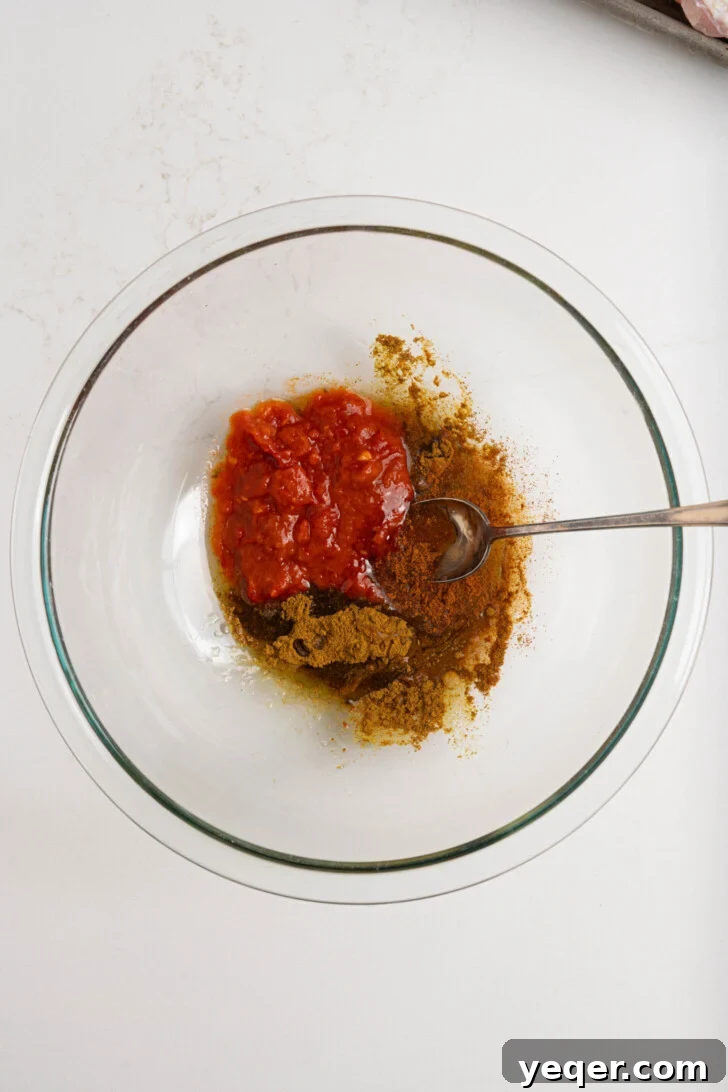 Spicy Sweet Harissa Honey Chicken 4 Harissa, spices, and oil in a bowl.