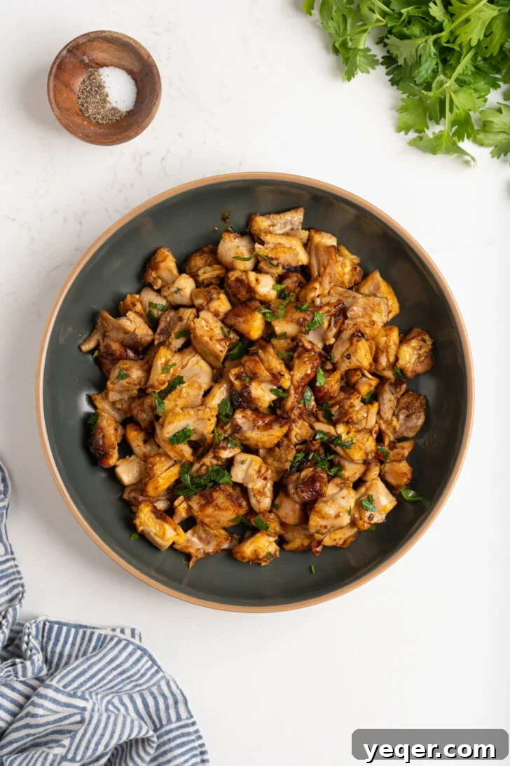 Spicy Sweet Harissa Honey Chicken 7 Diced harissa honey chicken in a bowl.