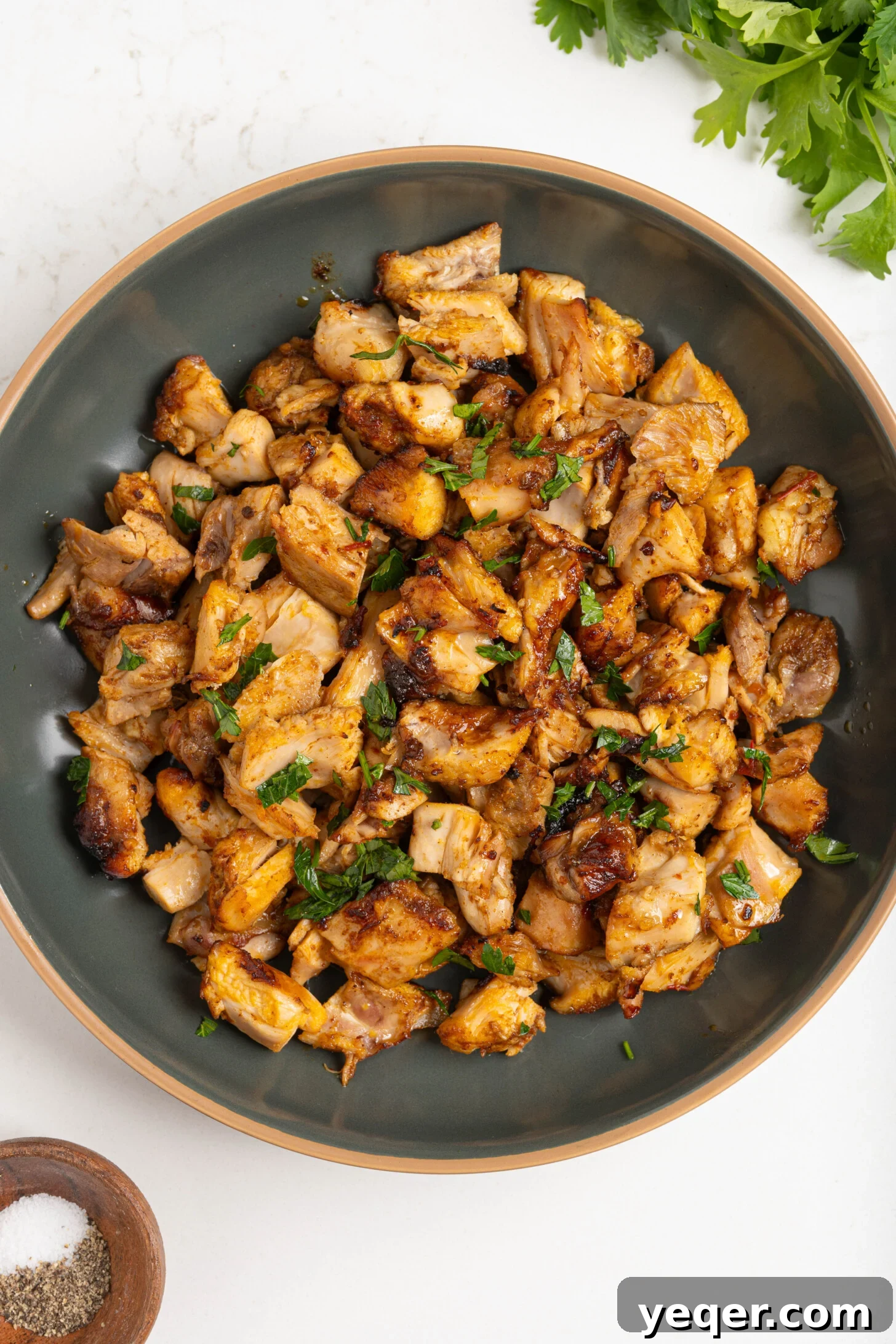 Spicy Sweet Harissa Honey Chicken 8 Diced harissa honey chicken in a bowl.