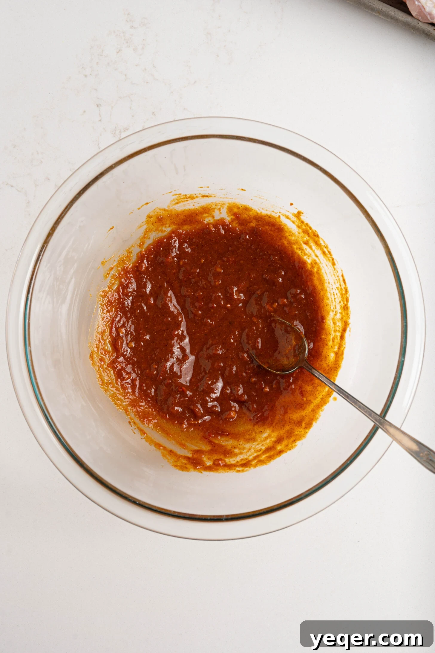 Spicy Sweet Harissa Honey Chicken 9 Harissa, spices, and oil in a bowl.