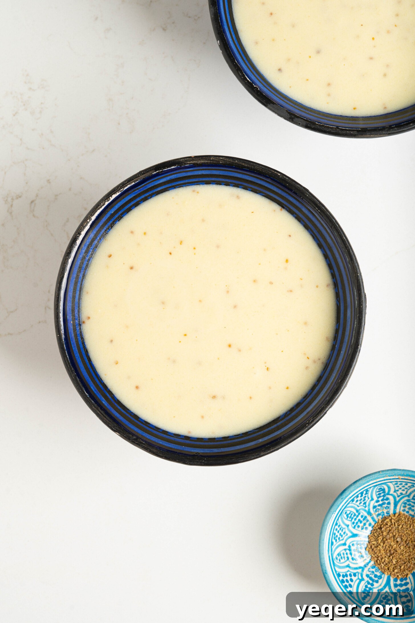 Baba's Moroccan Semolina Cold Remedy 9 A close-up shot of a warm, creamy bowl of Moroccan semolina soup, inviting viewers to taste its soothing goodness.