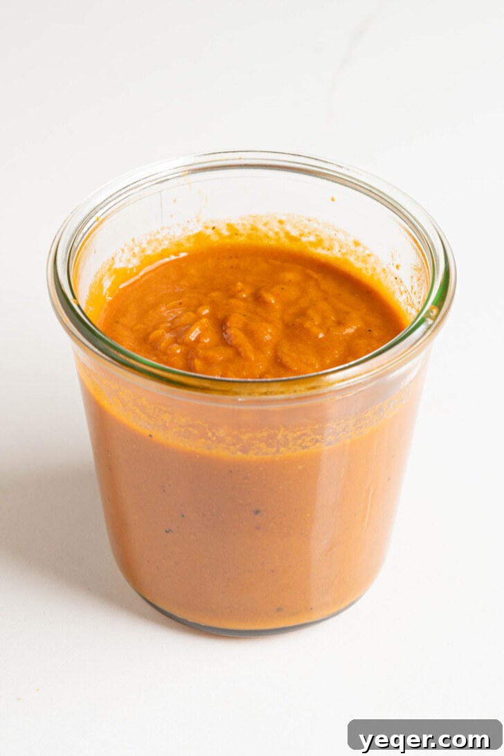 Fiery Spanish Patatas Bravas 7 Smooth and creamy salsa brava cooling in a jar after blending.
