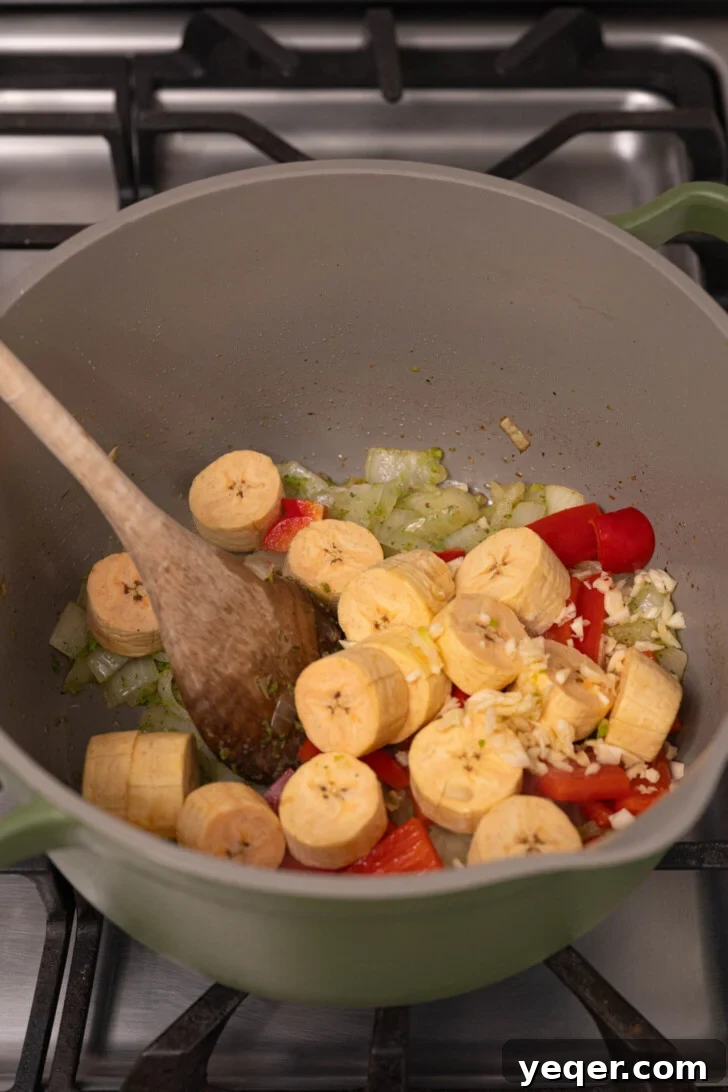 Plantains with garlic and onions in a pot.