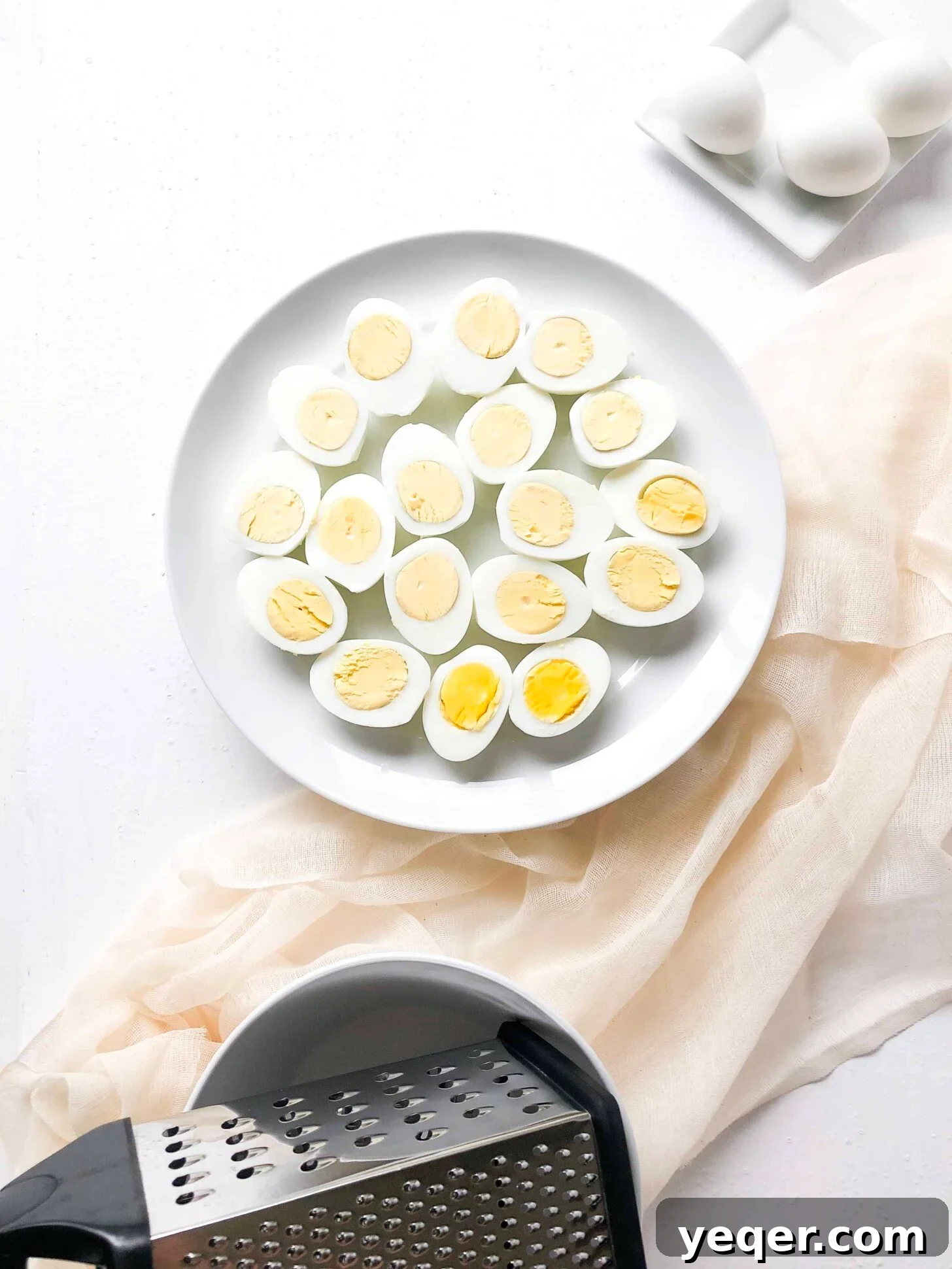 Heavenly Deviled Eggs 3 Hard boiled eggs cut in half, yolks removed, ready for filling