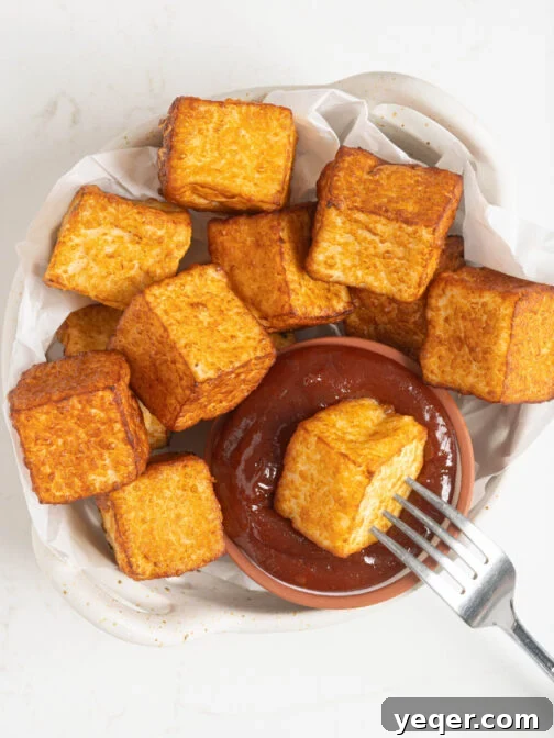 Crispy Queso Frito with Tropical Guava Drizzle 12 A bowl of queso frito with guava sauce.