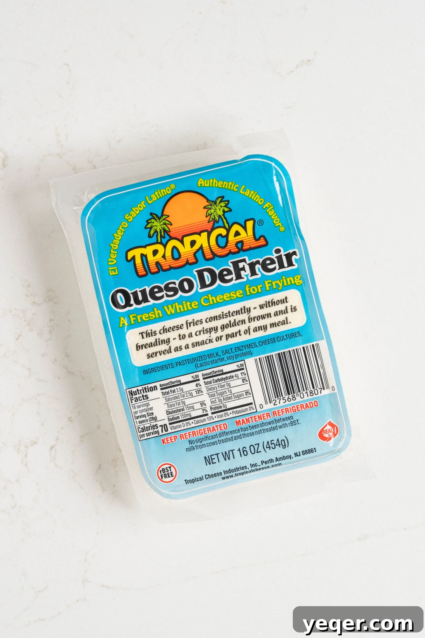 Crispy Queso Frito with Tropical Guava Drizzle 10 A neatly packaged block of 'Queso De Freir' cheese, displaying its label and texture.
