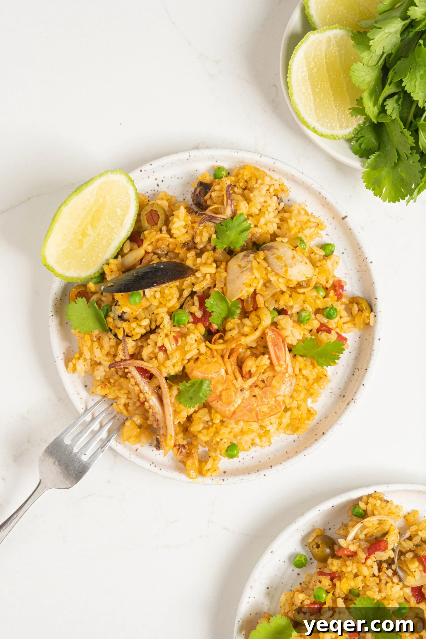 Vibrant Puerto Rican Seafood Rice 11 A close-up shot of a plate of Puerto Rican seafood rice, highlighting the diverse seafood and colorful rice grains.