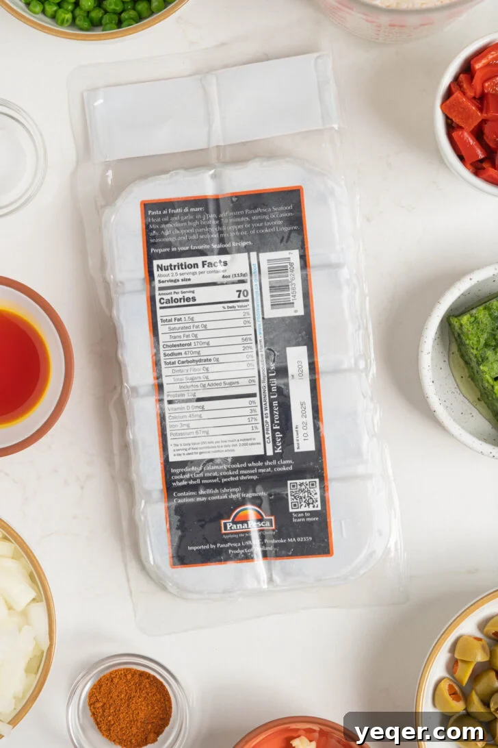 Vibrant Puerto Rican Seafood Rice 4 A package of frozen seafood mix with thawing instructions highlighted.