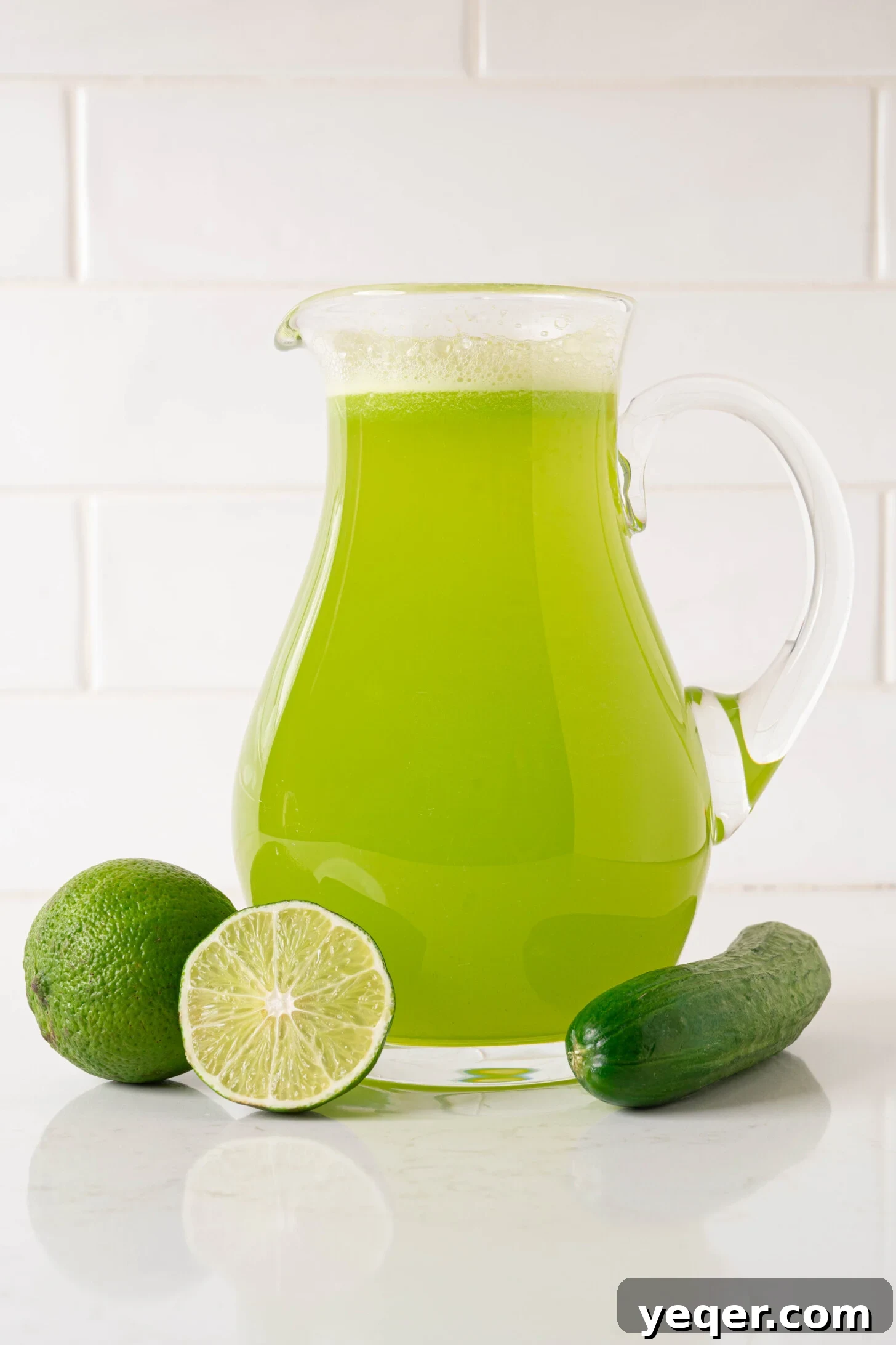 Cool Cucumber Lime Refresher 3 A pitcher of agua de pepino con limon, ready to be served, garnished with fresh cucumber and lime slices.