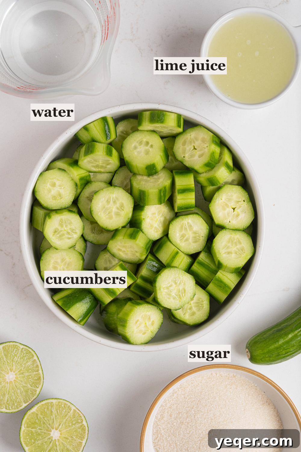 Cool Cucumber Lime Refresher 4 Bowls of chopped cucumbers, fresh lime juice, granulated sugar, and a pitcher of water, ready for blending.