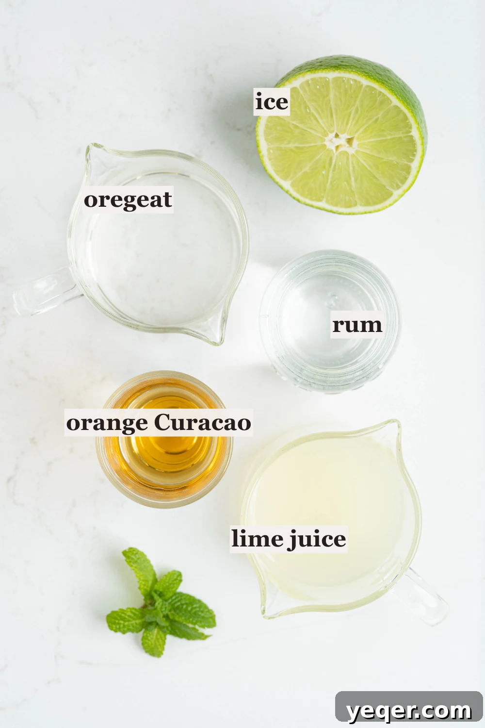 Authentic Mai Tai Cocktail 3 Individual ingredients for a Mai Tai laid out: cups of white rum, orange Curacao, lime juice, and Orgeat, ready for mixing.