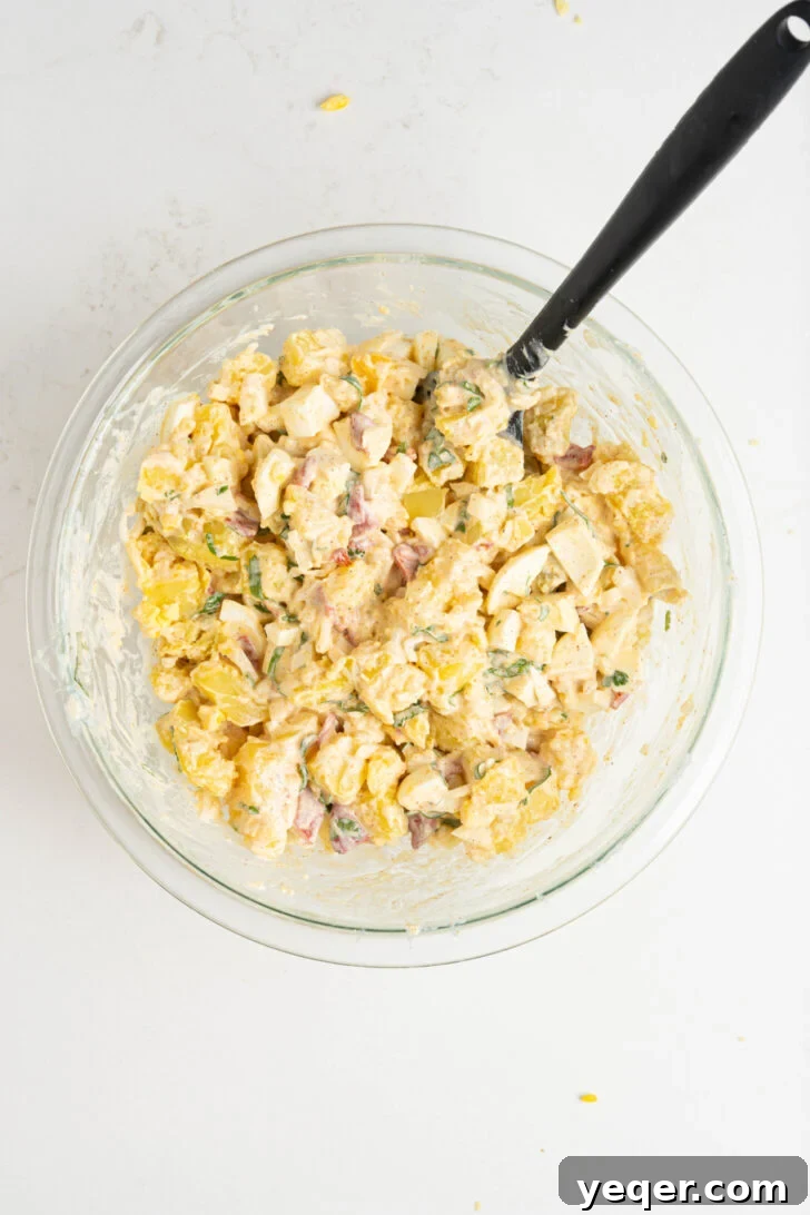 Puerto Rican Potato Salad 8 A bowl of ensalada de papa, beautifully mixed and garnished, ready to be served.