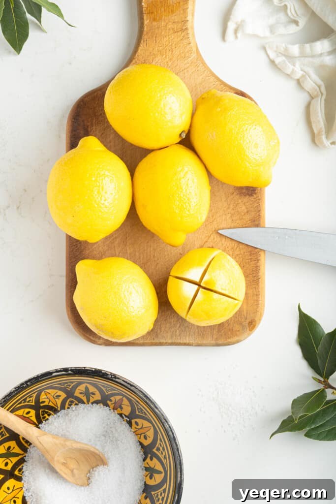Moroccan Preserved Lemons An Authentic Homemade Recipe 3 a cutting board with a scored lemon ready for preservation