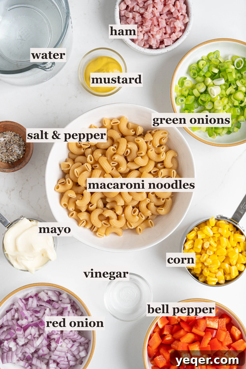 Signature Puerto Rican Macaroni Salad 3 Bowls of noodles, fresh vegetables, and diced ham, ready for making Puerto Rican macaroni salad ingredients.