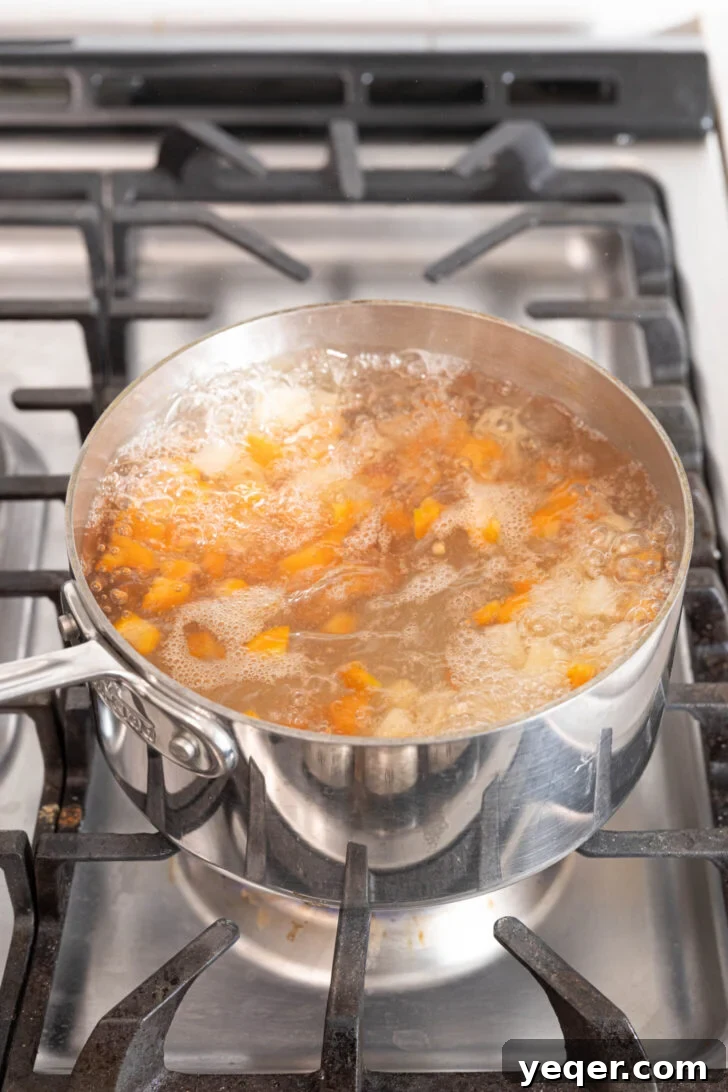 Fiesta Chicken Salad 5 Diced carrots and potatoes boiling in a separate pot of water until fork-tender.