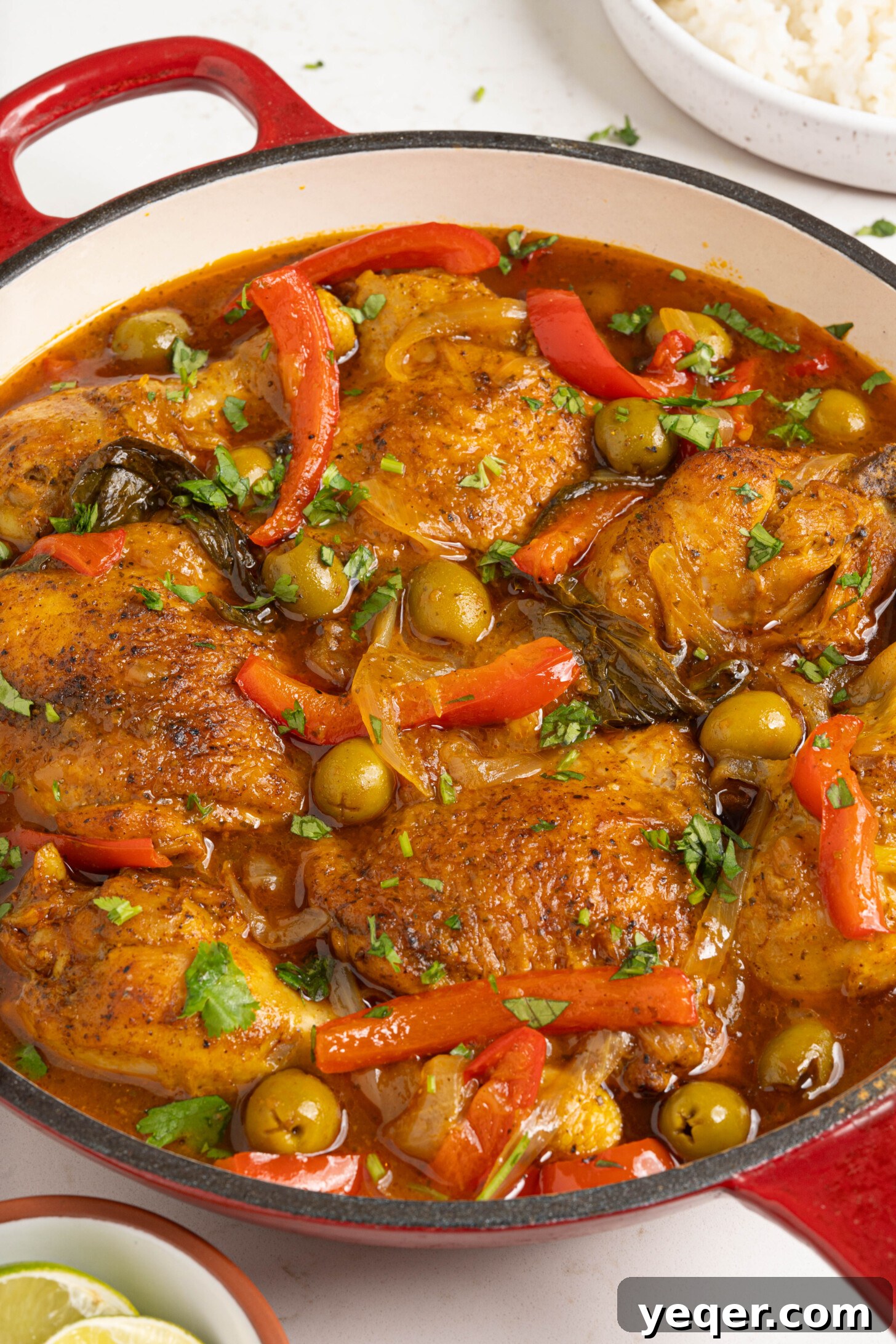 One-Pot Wonder Chicken Stew 9 A close-up shot of a pot of Pollo Guisado, rich in color and texture, with steam gently rising.