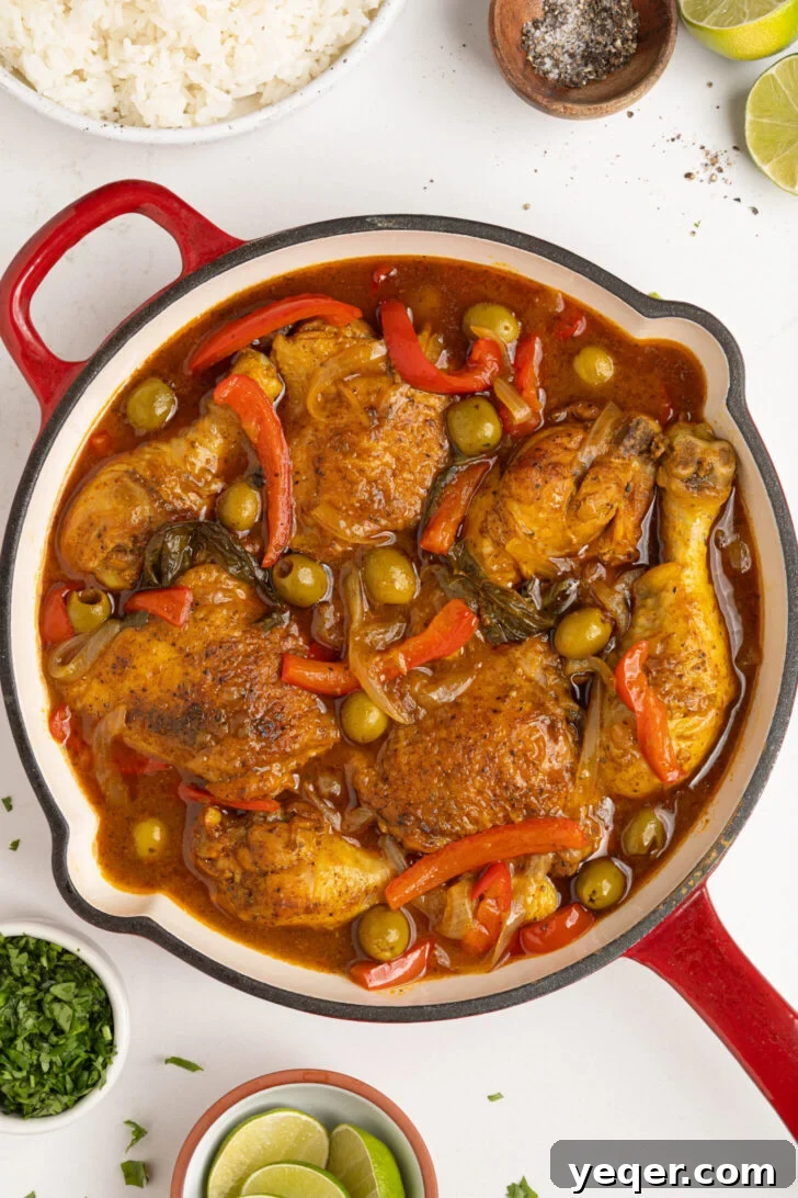 One-Pot Wonder Chicken Stew 8 Pollo Guisado simmering gently in a covered pot on low heat, developing deep flavors.