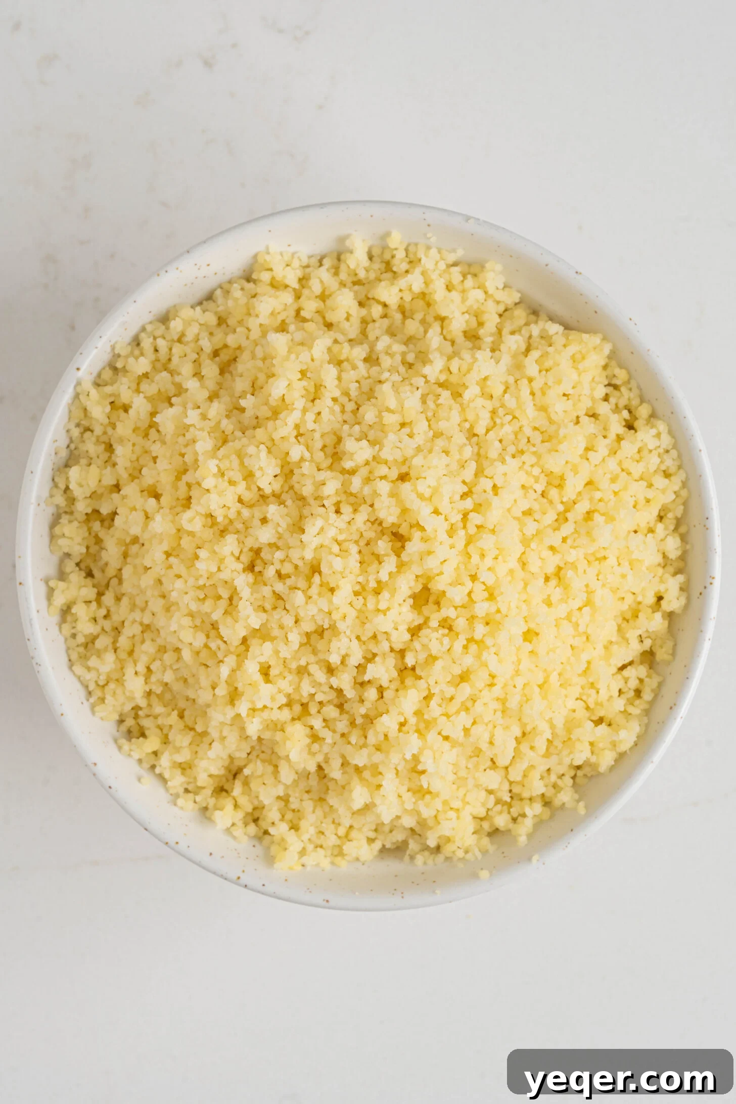 The Secret to Perfectly Fluffy Couscous 12 Another appealing shot of a bowl of fluffy couscous, highlighting its texture.