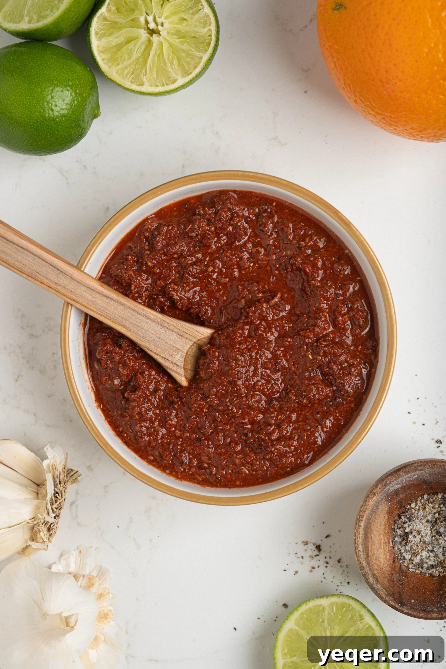 Homemade Achiote Paste in Minutes 7 A beautifully textured bowl of achiote paste, ready for culinary use, sitting on a kitchen counter.