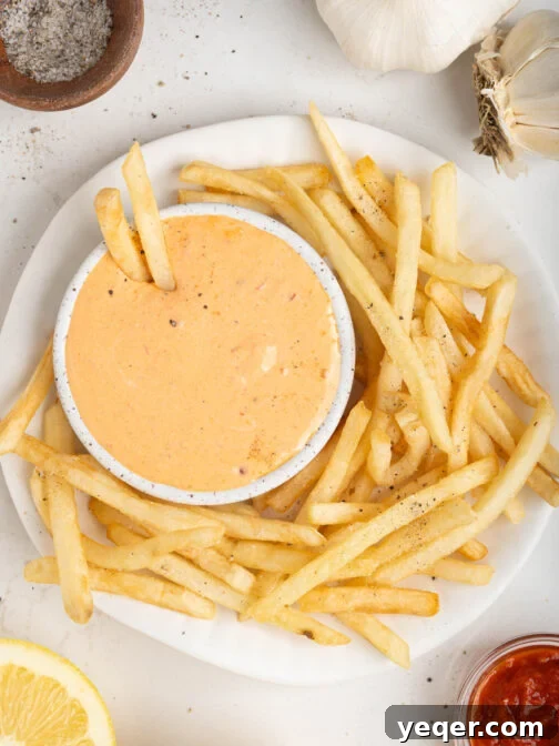A bowl of harissa aioli with fries.