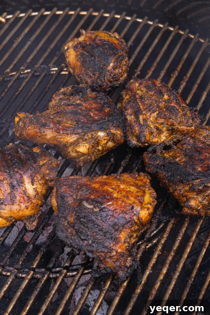 Flavorful Homemade Pollo Asado 6 Marinated Pollo Asado chicken pieces sizzling on a hot grill, showing a beautiful char.
