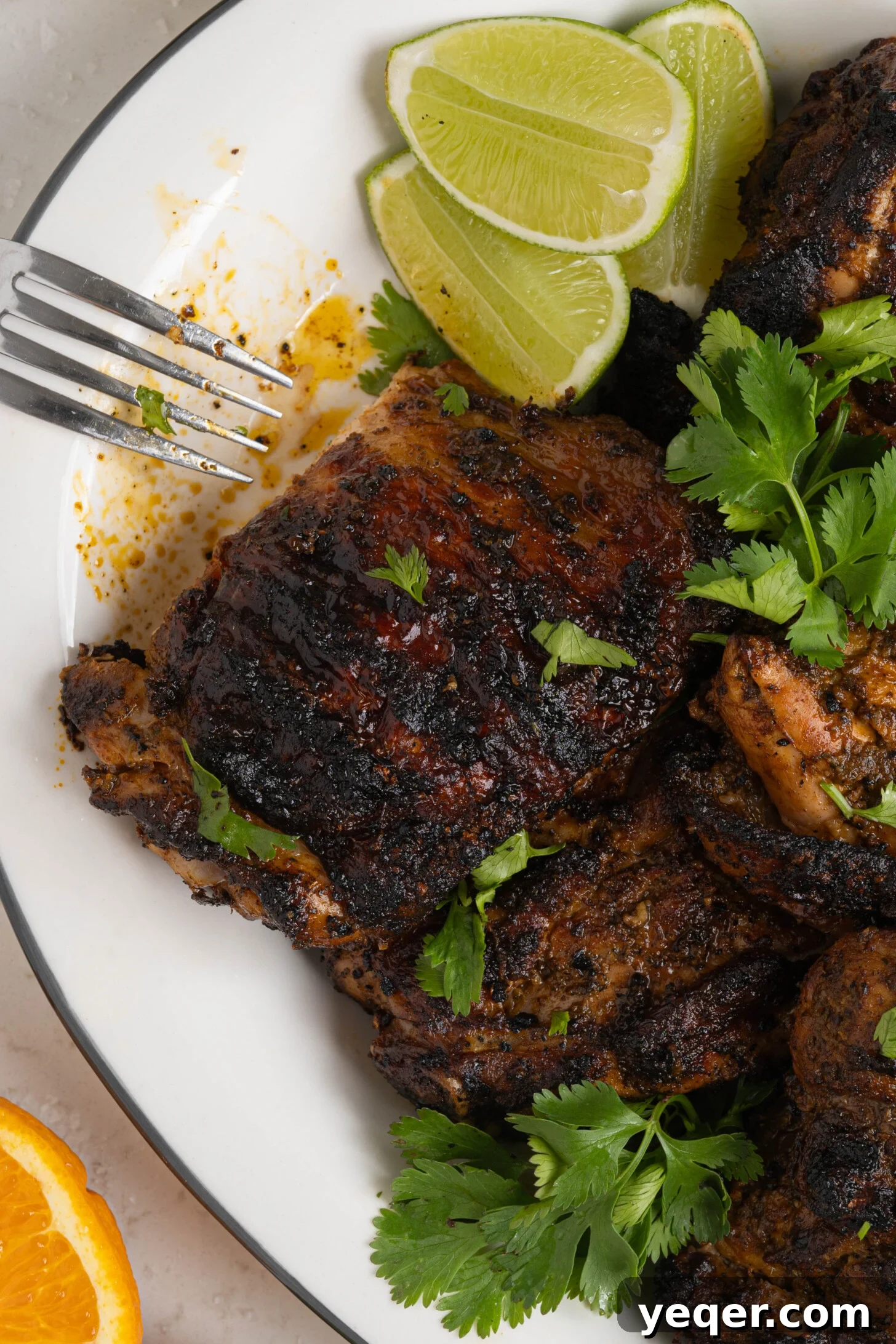 Flavorful Homemade Pollo Asado 9 A close-up shot of grilled Pollo Asado on a platter, highlighting the crispy skin and vibrant color, ready to be enjoyed.