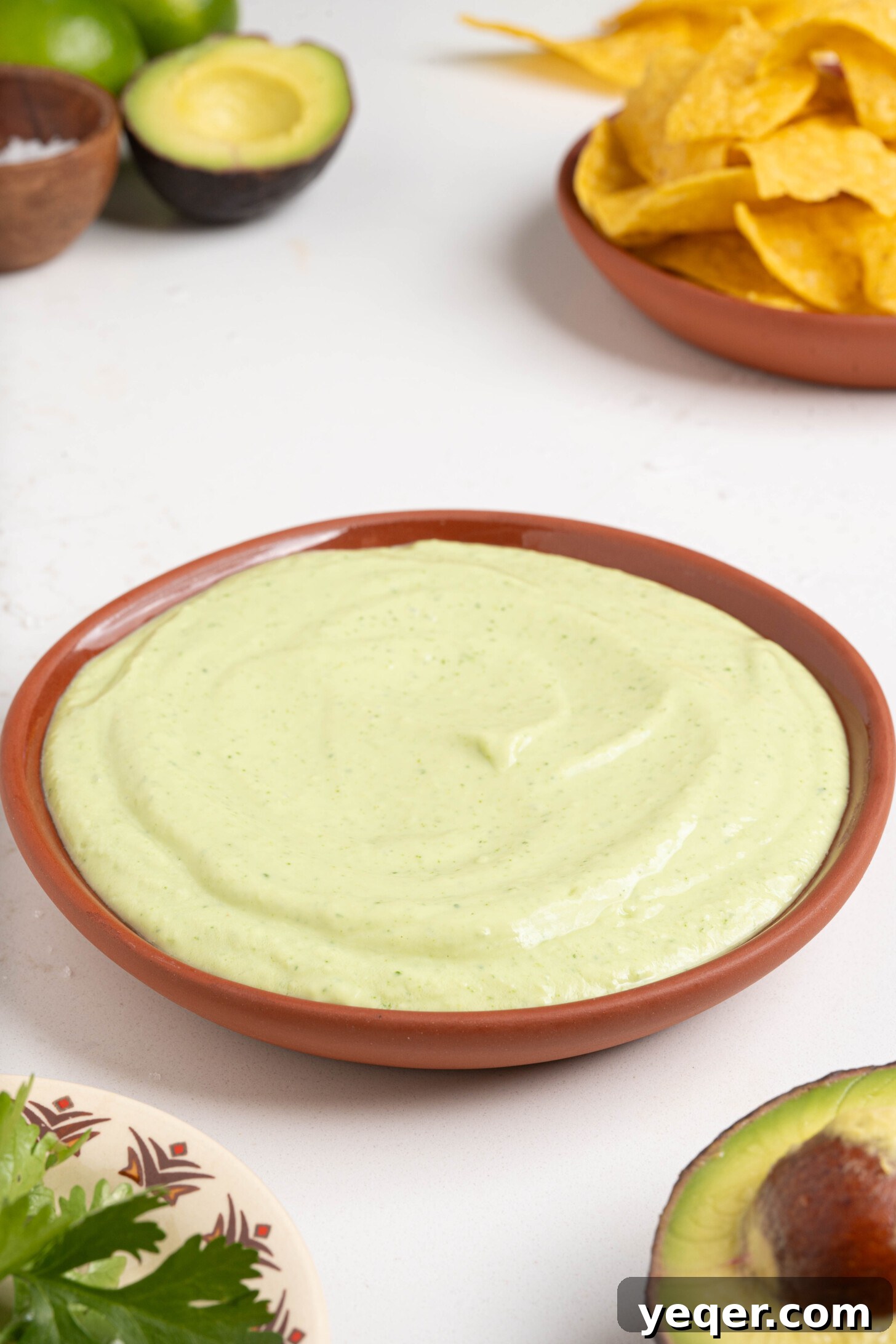 Velvety Greek Yogurt Avocado Dip 2 A bowl of creamy avocado dip, perfectly smooth and vibrant green, ready to be enjoyed.