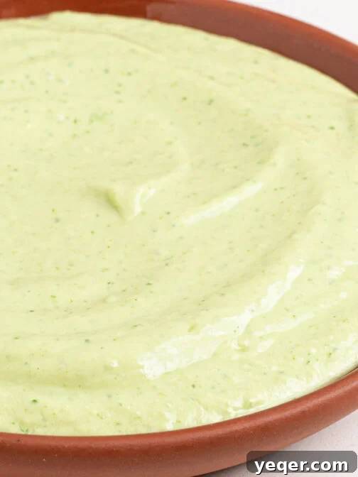 A bowl of creamy avocado dip.