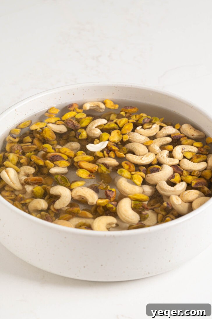 Creamy Pistachio Milk Made in Your Blender 5 Pistachios and cashews soaking in water.