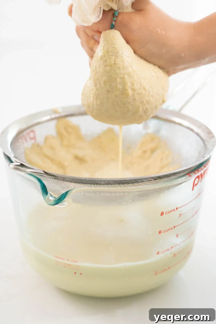 Creamy Pistachio Milk Made in Your Blender 7 Pistachio milk being strained.