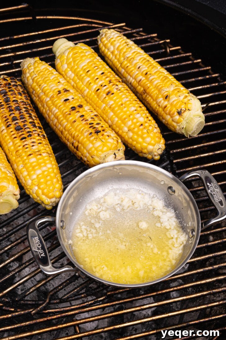 Grilled Mexican Street Corn Dip 6 Butter and minced garlic melting together in a small cast iron pan on the grill.