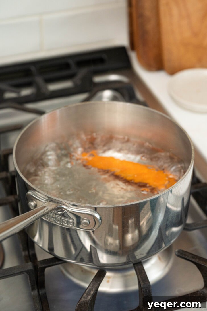 Tropical Fire Mango Habanero Sauce 5 A carrot boiling in water.