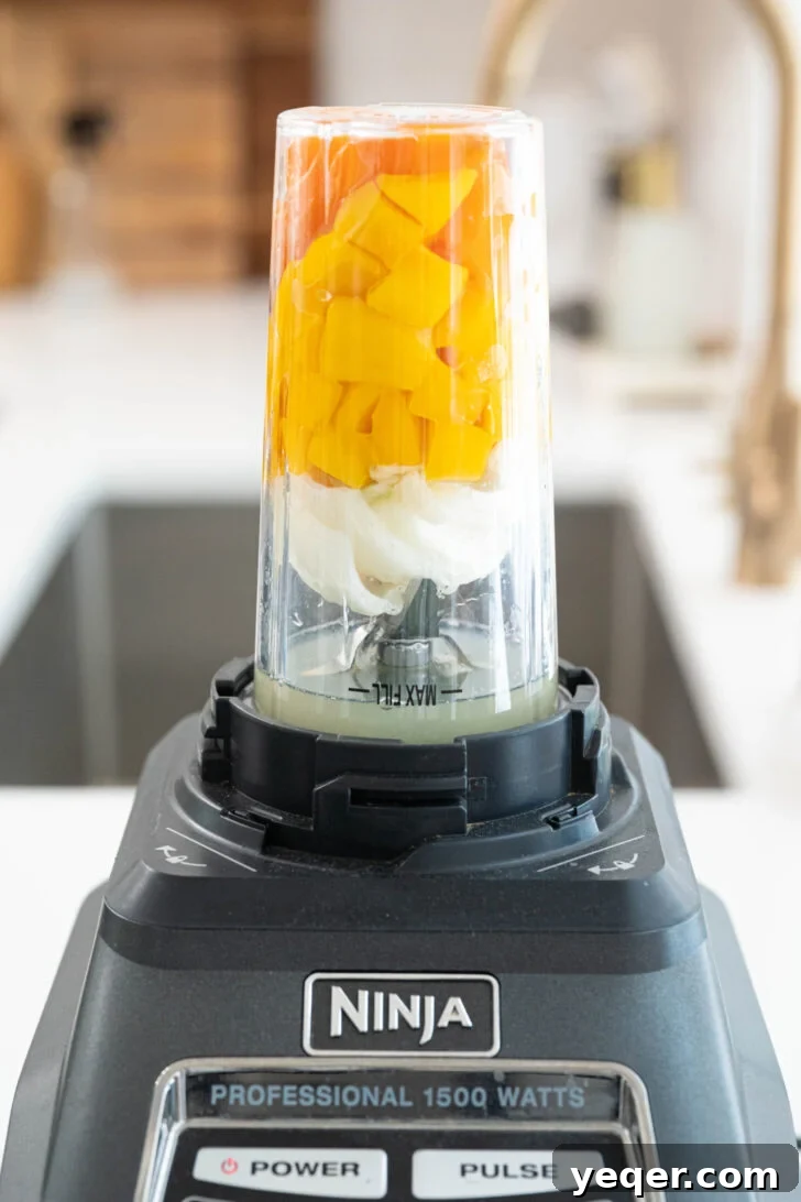 Tropical Fire Mango Habanero Sauce 6 Mango habanero sauce in a blender.