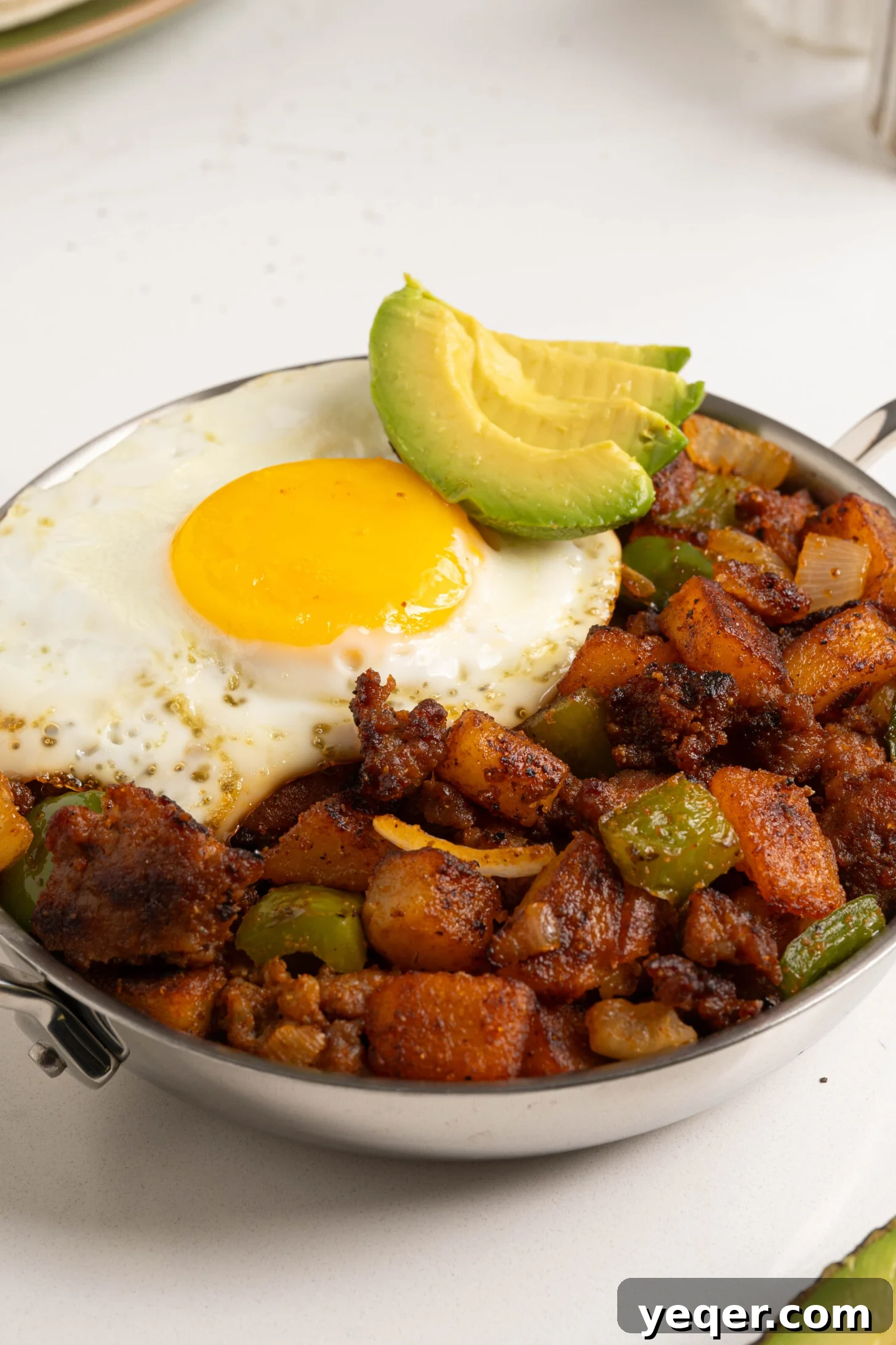 Savory Chorizo, Potato, and Egg Skillet 11 A vibrant and fully cooked Chorizo Breakfast Hash in a skillet, ready to be served.